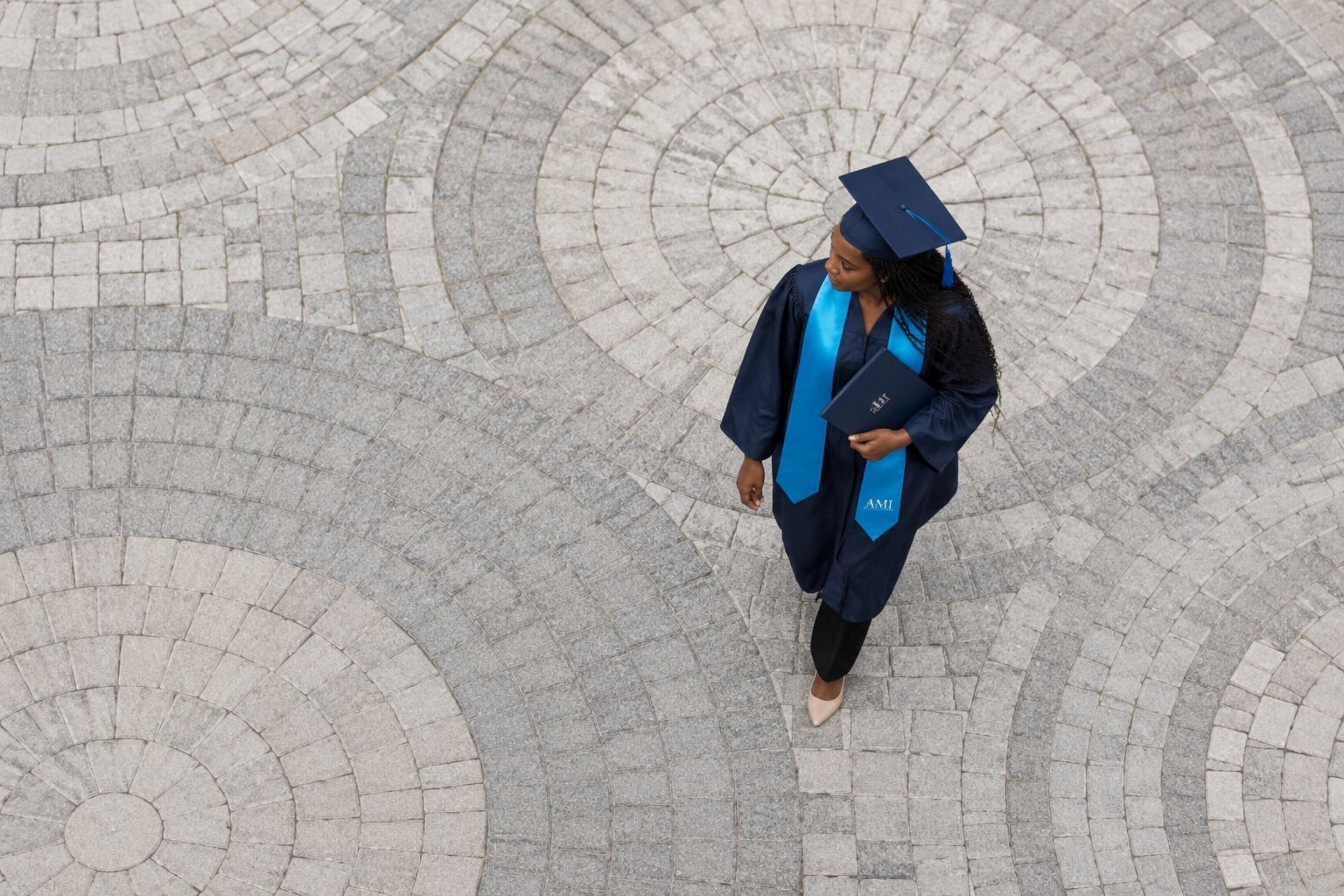Aspire Medical Institute graduate in cap and gown